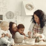 Three generations baking together in a bright kitchen, showcasing love and tradition.